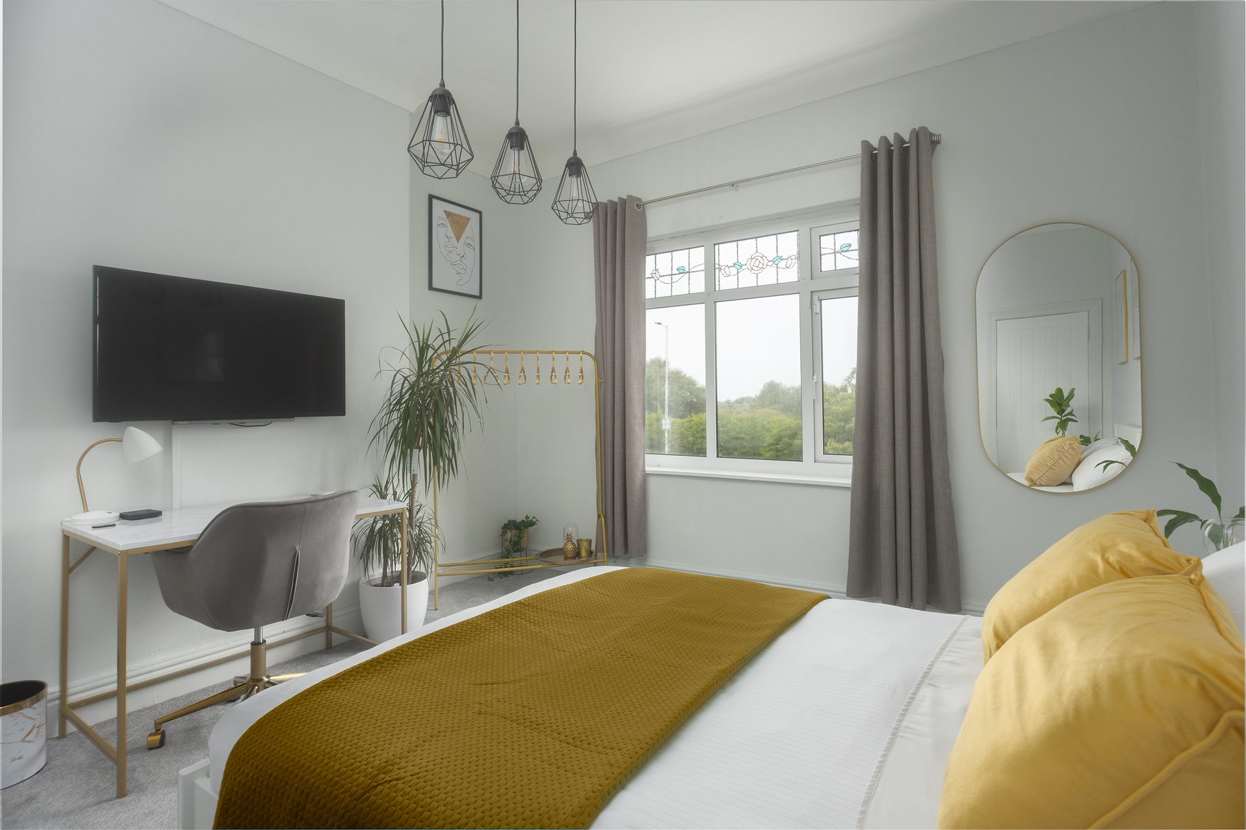 A private workspace beside the bedroom window.