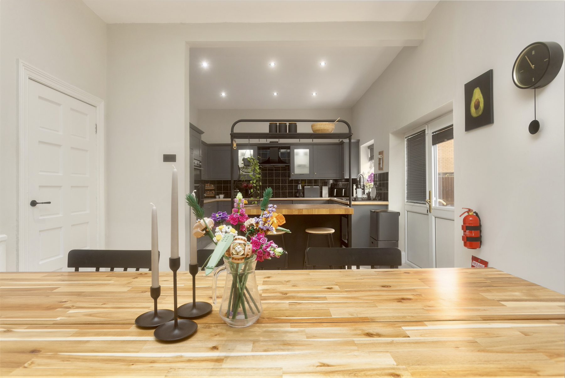 The dining area at Willow Bank, set with candles and fresh flowers.