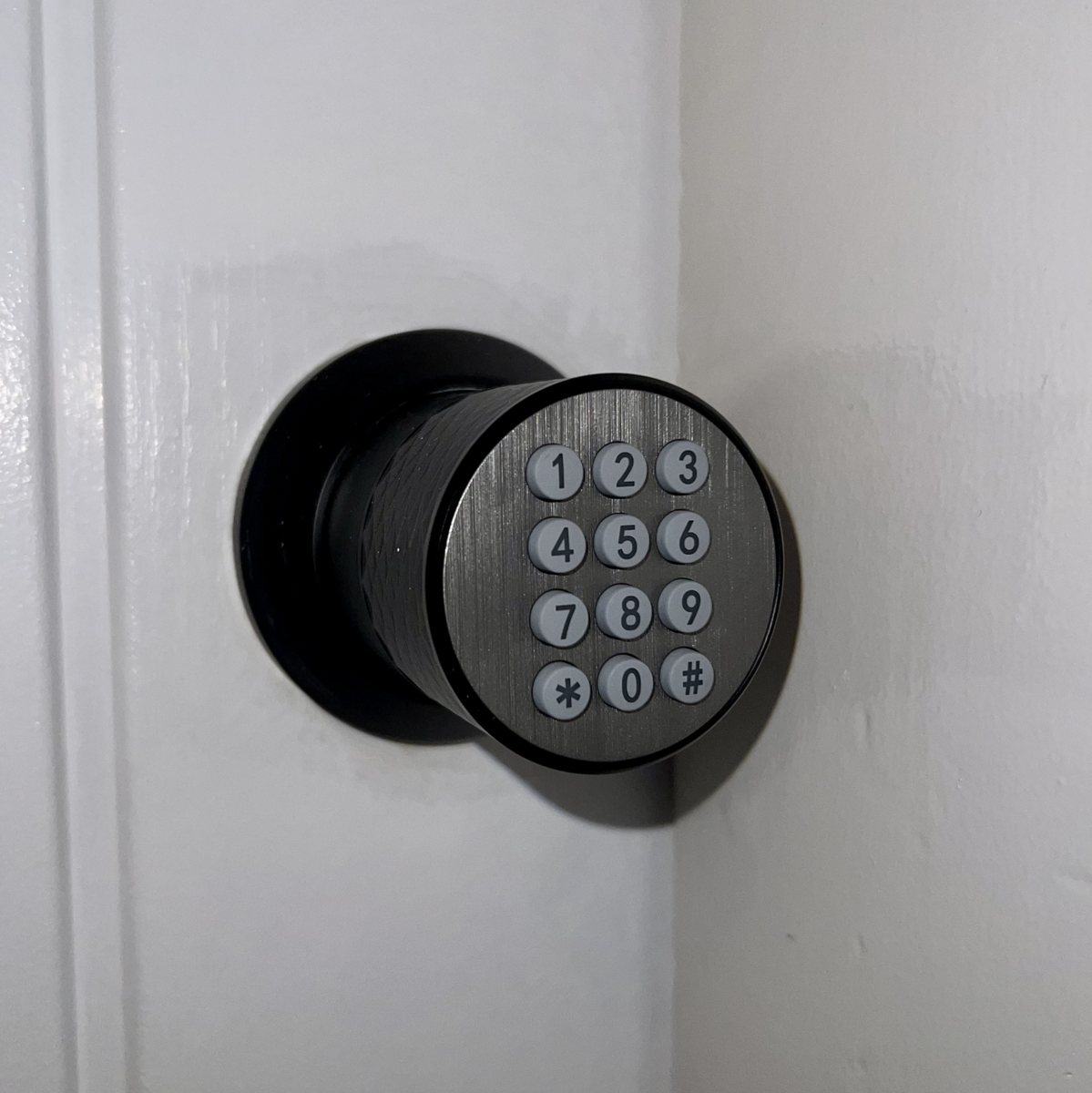 A keypad door lock on a guest room door.